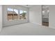 Bedroom with carpet floors and large windows that provide natural light and backyard view at 1042 W Ridge Rd, Apache Junction, AZ 85120