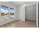 Bright bedroom with tile flooring and an open doorway with natural light at 1042 W Ridge Rd, Apache Junction, AZ 85120