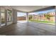 Covered patio overlooking backyard with artificial turf and desert landscaping at 1042 W Ridge Rd, Apache Junction, AZ 85120