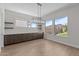 Dining area featuring stylish lighting fixture, base cabinets and views to the yard at 1042 W Ridge Rd, Apache Junction, AZ 85120