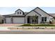 Beautiful two-story home with a manicured lawn and a three-car garage at 1042 W Ridge Rd, Apache Junction, AZ 85120