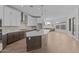 Modern kitchen with a central island, stainless steel appliances, and abundant counter space at 1042 W Ridge Rd, Apache Junction, AZ 85120