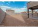 Large backyard with block wall and new construction home at 18336 W Daley Ln, Surprise, AZ 85387