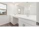 Modern bathroom with double vanity and tile flooring at 18336 W Daley Ln, Surprise, AZ 85387