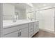 Modern bathroom with double vanity and a walk-in shower at 18336 W Daley Ln, Surprise, AZ 85387