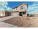 Two-story house with gray siding, blue shutters, and a two-car garage at 18336 W Daley Ln, Surprise, AZ 85387