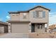 Two-story house with gray siding, blue shutters, and a two-car garage at 18336 W Daley Ln, Surprise, AZ 85387