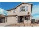 Two-story house with gray siding, blue shutters, and a two-car garage at 18336 W Daley Ln, Surprise, AZ 85387