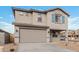 Two-story house with gray siding, blue shutters, and a two-car garage at 18336 W Daley Ln, Surprise, AZ 85387