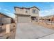 Two-story house with gray siding, blue shutters, and a two-car garage at 18336 W Daley Ln, Surprise, AZ 85387