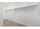 Large walk-in closet with ample hanging space at 18336 W Daley Ln, Surprise, AZ 85387