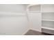 This walk-in closet features built-in shelving and ample storage space at 18762 E Panchito Dr, Gold Canyon, AZ 85118