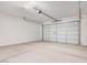Spacious two car garage with a modern door and concrete flooring at 18762 E Panchito Dr, Gold Canyon, AZ 85118