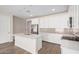 Bright kitchen featuring stainless steel appliances, ample counter space, and a center island with a sink at 18762 E Panchito Dr, Gold Canyon, AZ 85118