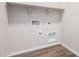 Clean laundry room with shelving and connections for washer and dryer at 18762 E Panchito Dr, Gold Canyon, AZ 85118