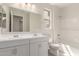 This bathroom features double sinks, white cabinetry, and a shower over tub with subway tile surround at 18792 E Panchito Dr, Gold Canyon, AZ 85118