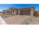 Charming two-story home with a two-car garage and stone veneer accents on the facade at 18792 E Panchito Dr, Gold Canyon, AZ 85118