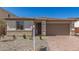 Charming single-story home featuring desert landscaping and a two-car garage at 18792 E Panchito Dr, Gold Canyon, AZ 85118