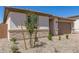 A house with desert landscaping featuring stone veneer accents on the exterior facade at 18792 E Panchito Dr, Gold Canyon, AZ 85118