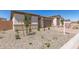 A house with desert landscaping featuring stone veneer accents on the exterior at 18792 E Panchito Dr, Gold Canyon, AZ 85118
