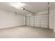 This two car garage features a clean concrete floor and an automatic door at 18792 E Panchito Dr, Gold Canyon, AZ 85118