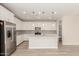 Contemporary kitchen with an island, stainless steel appliances, and ample cabinet space at 18792 E Panchito Dr, Gold Canyon, AZ 85118