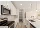 Well-appointed kitchen showcasing a stainless steel range, microwave, and spacious pantry at 18792 E Panchito Dr, Gold Canyon, AZ 85118