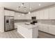 Bright, modern kitchen with white cabinets, stainless steel appliances, and a center island at 18792 E Panchito Dr, Gold Canyon, AZ 85118