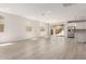 Spacious living area featuring sleek floors and an open layout into the kitchen at 18792 E Panchito Dr, Gold Canyon, AZ 85118