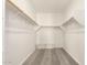 Spacious walk-in closet with shelving and ample storage, featuring neutral carpet at 18792 E Panchito Dr, Gold Canyon, AZ 85118
