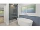 Modern bathroom with a large soaking tub and walk-in shower at 4555 N 5Th Ave, Phoenix, AZ 85013