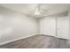 Bedroom featuring large closet, ceiling fan, and ample lighting at 11133 W Cameo Dr, Sun City, AZ 85351