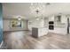 Open kitchen with stainless appliances, dining area, and breakfast bar perfect for entertaining guests and Gathering at 11133 W Cameo Dr, Sun City, AZ 85351