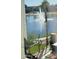 Scenic lake view with fountain, palm tree and patio furniture at 2511 W Queen Creek Rd # 205, Chandler, AZ 85248