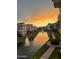 Beautiful sunset view of the water and walking path around the building at 2511 W Queen Creek Rd # 205, Chandler, AZ 85248