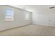 Well-lit bedroom featuring carpeted floors and window blinds at 25588 N 154Th Ln, Surprise, AZ 85387