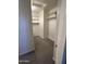 Spacious walk-in closet featuring built-in shelves and rods at 4526 E Vista Bonita Dr, Phoenix, AZ 85050