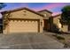 Charming single-story home featuring a two-car garage and desert landscaping at 4548 E Carob Dr, Gilbert, AZ 85298
