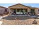 Relaxing outdoor patio with seating, a grill, and a spacious backyard at 4548 E Carob Dr, Gilbert, AZ 85298