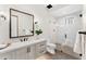 Modern bathroom featuring a spacious walk-in shower, decorative mirror, and elegant vanity at 9989 E Aleka Way # 337, Scottsdale, AZ 85262