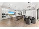 Modern kitchen with large island, stainless steel appliances, and stylish dining area, perfect for entertaining at 9989 E Aleka Way # 337, Scottsdale, AZ 85262