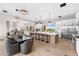 Modern kitchen with a large island, stainless steel appliances, and a stylish dining area at 9989 E Aleka Way # 337, Scottsdale, AZ 85262