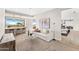Bright and airy living room with sleek hardwood floors and a scenic desert view from the breakfast bar at 9989 E Aleka Way # 337, Scottsdale, AZ 85262
