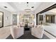 Cozy seating area with four chairs, wine storage, statement chandelier, and seamless access to the patio at 9989 E Aleka Way # 337, Scottsdale, AZ 85262