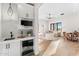 Inviting living space visible from the kitchenette with modern appliances and stylish tile backsplash at 9989 E Aleka Way # 337, Scottsdale, AZ 85262