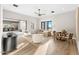 Airy living area featuring a dining table, comfortable seating, sleek fixtures, and bright, natural light at 9989 E Aleka Way # 337, Scottsdale, AZ 85262