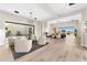 Bright, open living room featuring a fireplace, large windows, and seamless indoor-outdoor living at 9989 E Aleka Way # 337, Scottsdale, AZ 85262