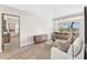 Bright living room featuring hardwood floors, modern decor and a stunning desert view from the breakfast bar at 9989 E Aleka Way # 337, Scottsdale, AZ 85262