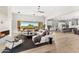 Spacious living area featuring a fireplace, large windows, and a modern open-concept layout at 9989 E Aleka Way # 337, Scottsdale, AZ 85262