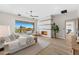 Serene bedroom boasting hardwood floors, a fireplace, patio access, and stunning views of the desert landscape at 9989 E Aleka Way # 337, Scottsdale, AZ 85262